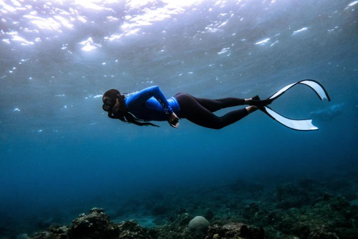 a man swimming in a body of water